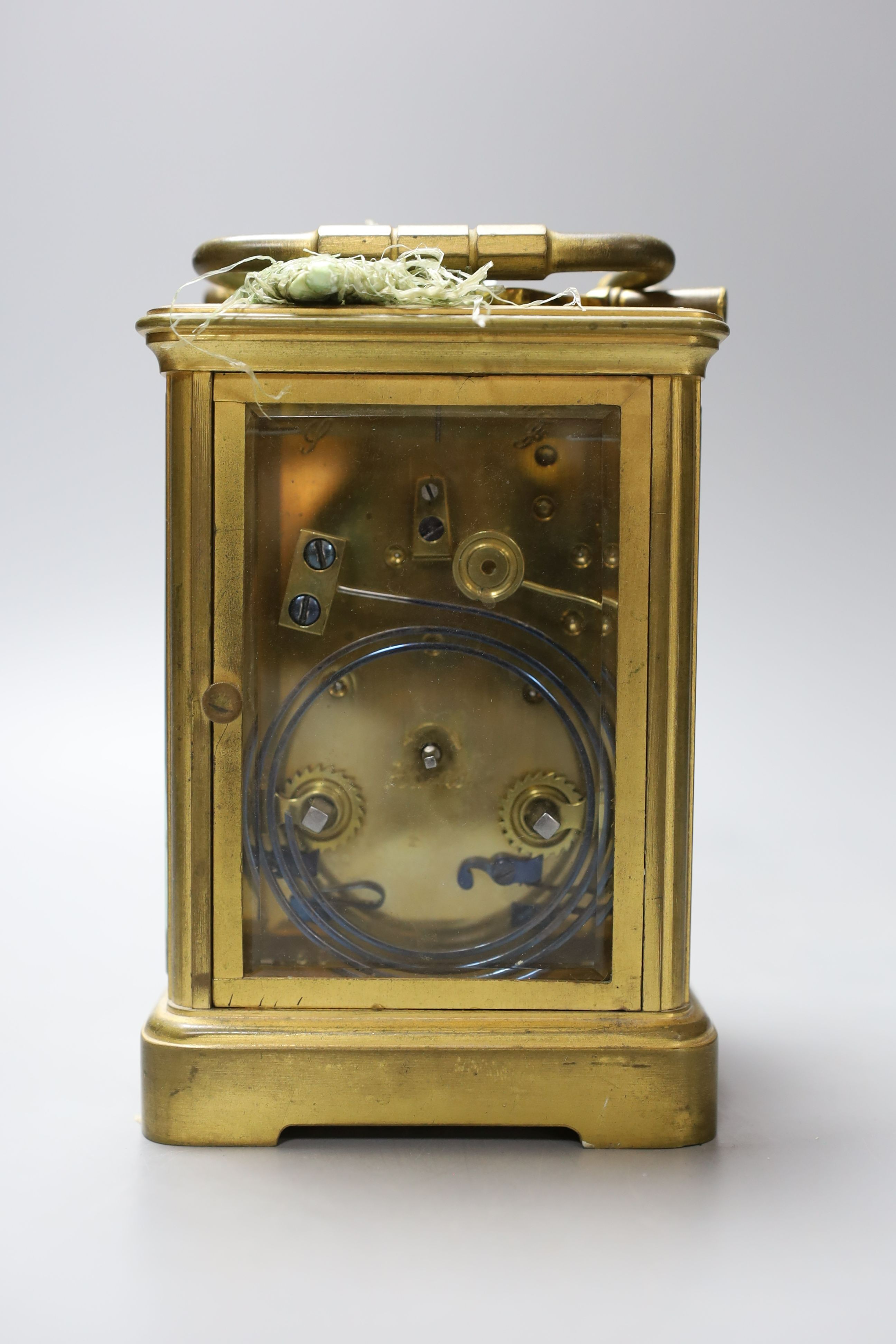 A leather cased brass carriage clock